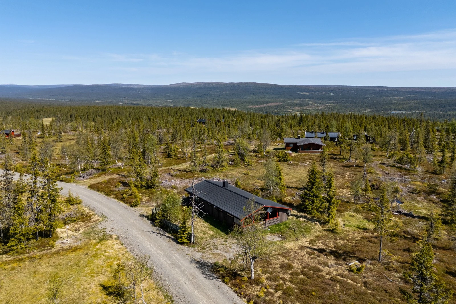 Dining room with glass table and beige chairs